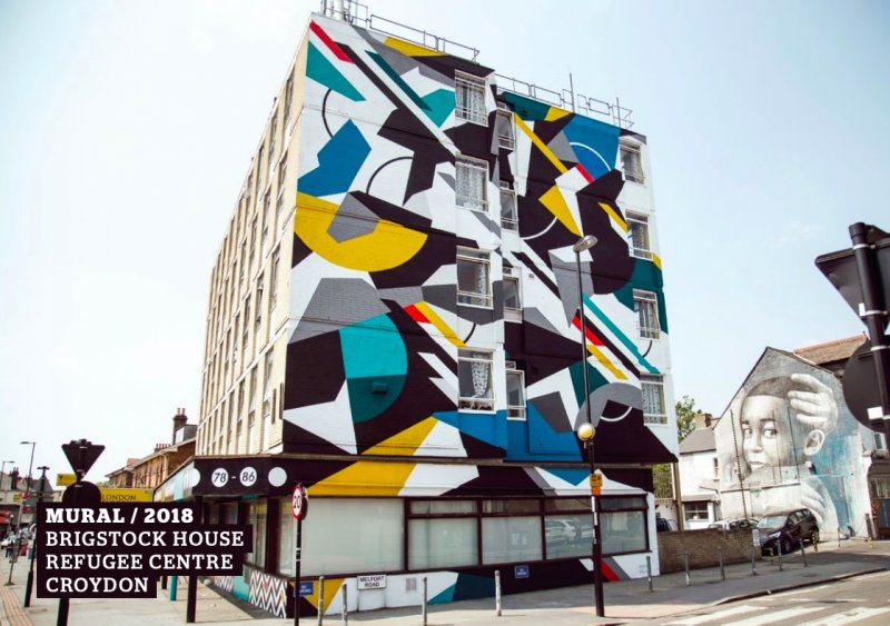 Large building with abstract art over the side