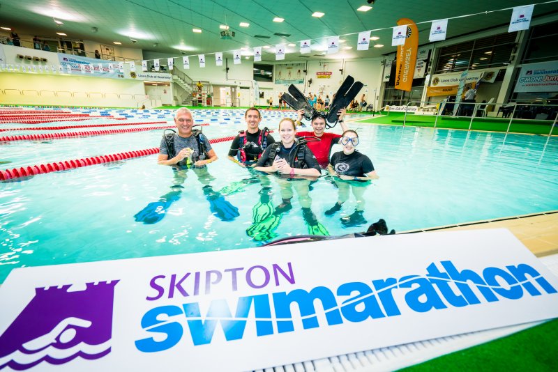 people in pool swimming in Skipton Swimarathon