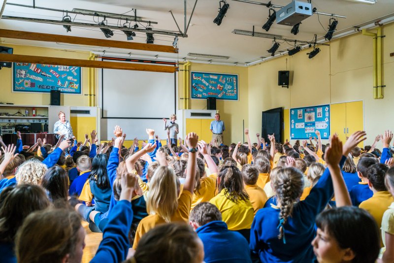 an assembly full of school children