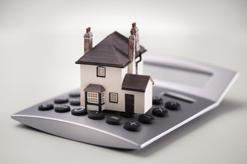 House model on oversized calculator