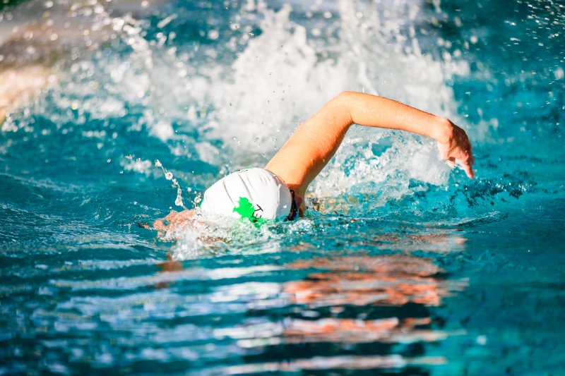 Person swimming in pool
