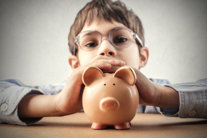 Child holding piggy bank