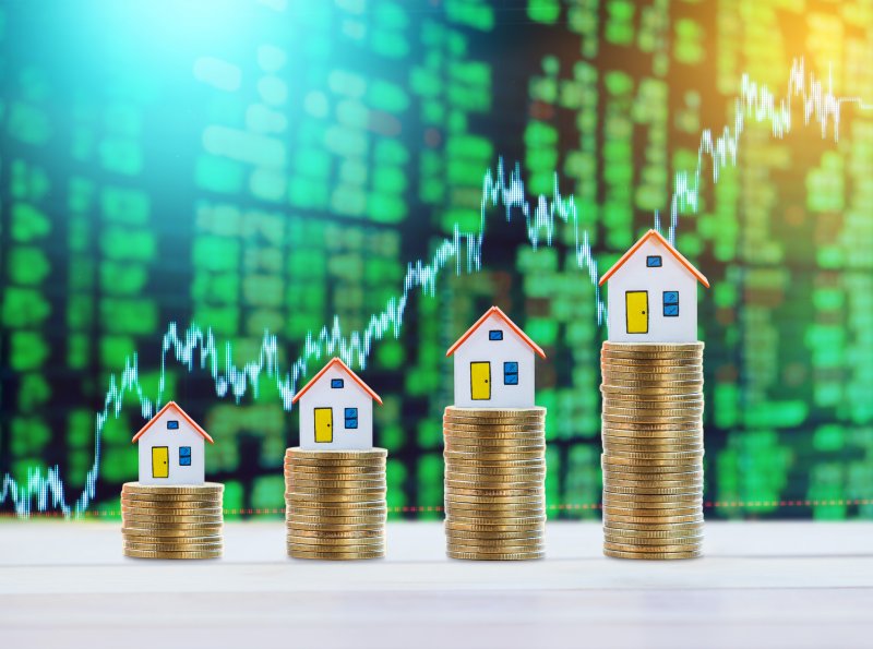 pennies increasing in size with house on top